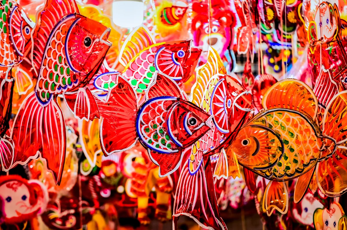 Red and orange carp-shaped paper lanterns hung for the Mid-Autumn Festival