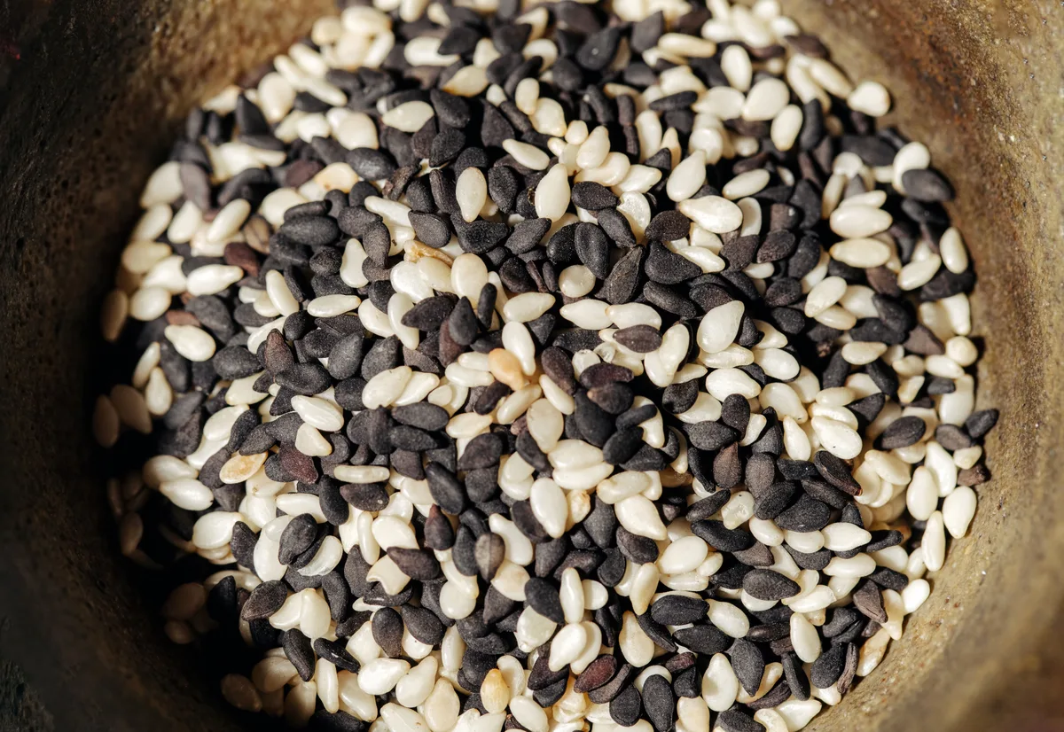 A bowl of mixed black and white sesame seeds