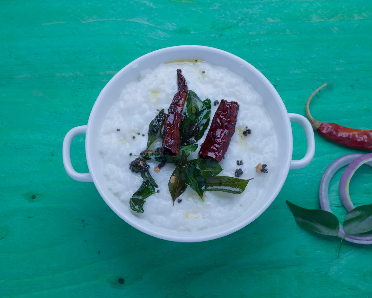 South Indian curd rice finished with fried curry leaves, mustard seeds and dried red chilies
