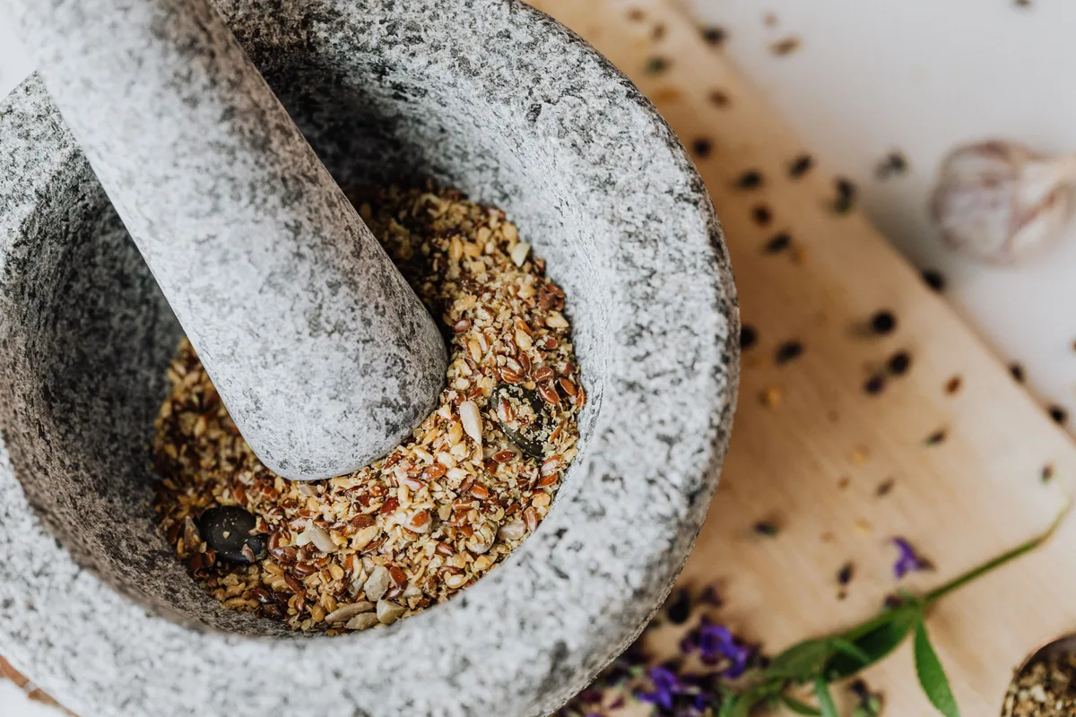 Spices crushed coarse in a granite mortar and pestle